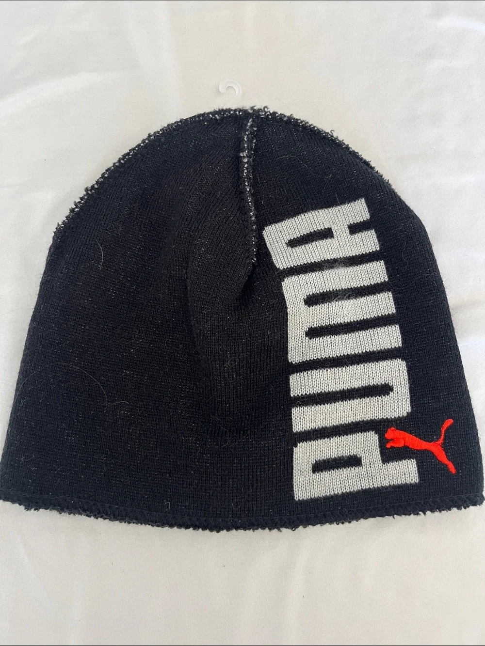 Puma Kids Black Beanie with White Branding and Red Puma Logo